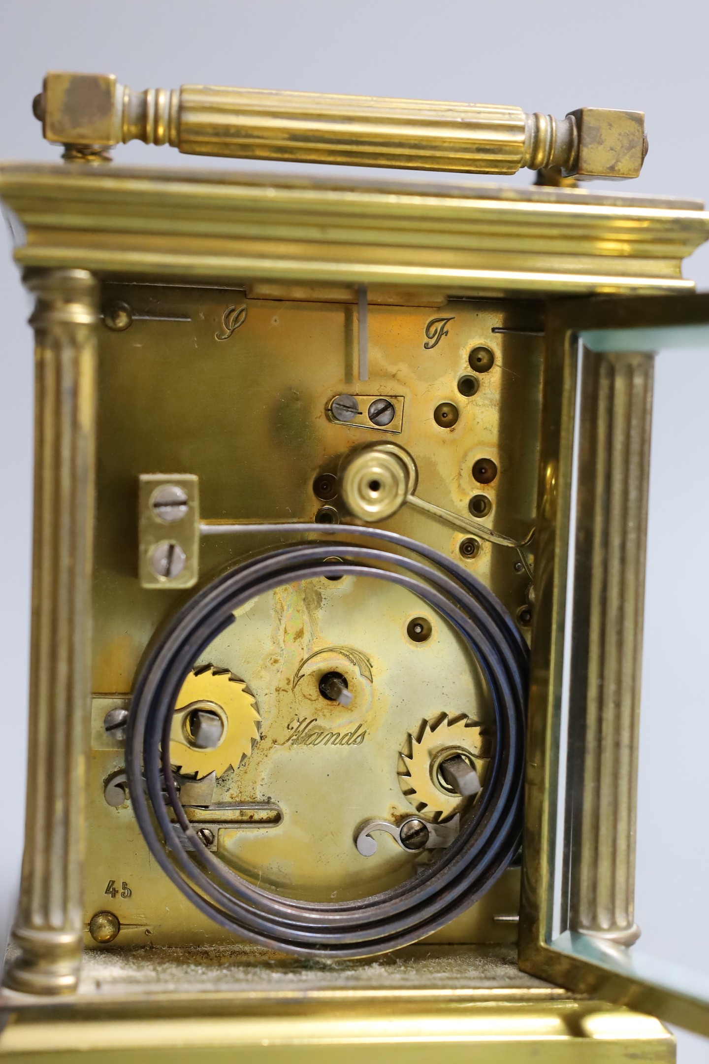 A French quarter repeating gilt brass carriage clock, 14 cms high